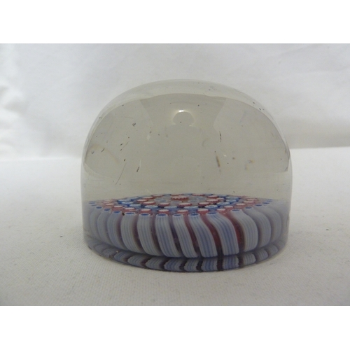 27 - An old English magnum glass paperweight, of red,white and blue concentric canes, 9 cm diam approx.