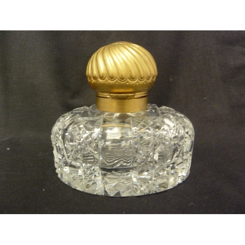 185 - An English cut glass partners inkwell, with gilded metal mounts and cover, 15cm high.