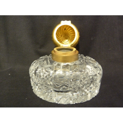 185 - An English cut glass partners inkwell, with gilded metal mounts and cover, 15cm high.