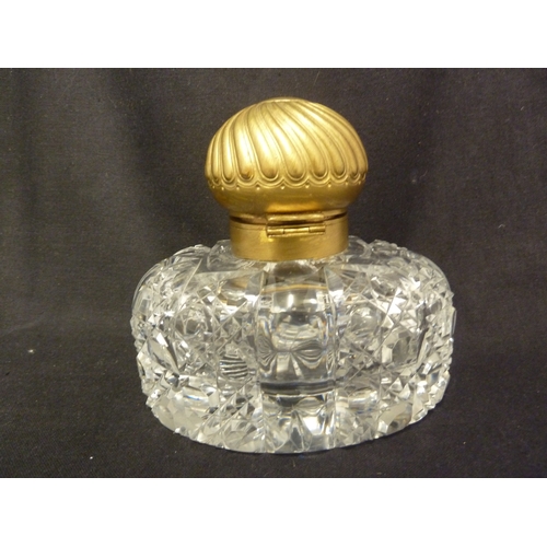 185 - An English cut glass partners inkwell, with gilded metal mounts and cover, 15cm high.