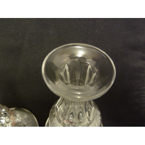 176 - Stevens and Williams - a pair of intaglio cut glass decanters, bell form with acorn form stoppers cu... 