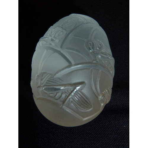 47 - Lalique - Oeuf Grillons, A frosted glass egg decorated with cricket insects on grasses; and the orig... 