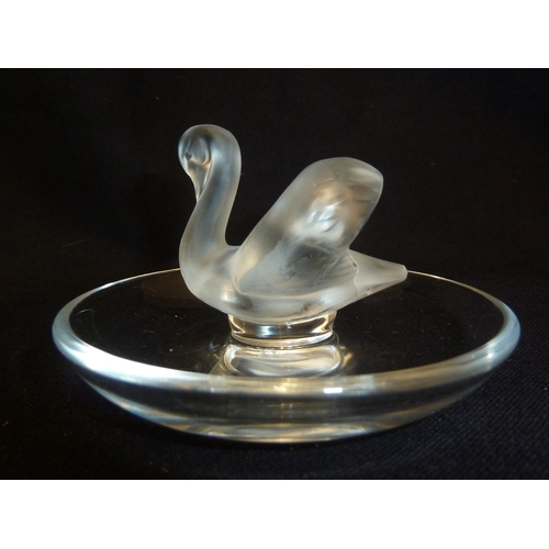 46 - Lalique - A swan cendrier, the frosted single bird on a circular colorless glass base, hand etched m... 