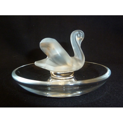 46 - Lalique - A swan cendrier, the frosted single bird on a circular colorless glass base, hand etched m... 