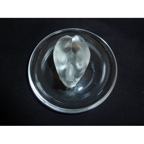 46 - Lalique - A swan cendrier, the frosted single bird on a circular colorless glass base, hand etched m... 