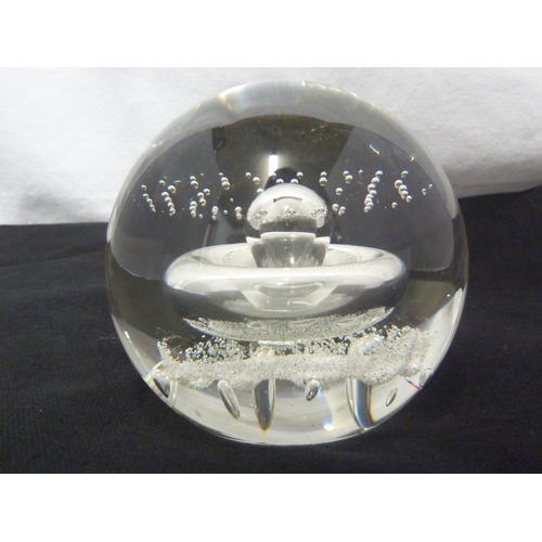 32 - A Caithness glass paperweight - Starwatch, with air inclusion of a globular 'planet' with concentric... 