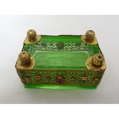 92 - Heinrich Hoffman - A green glass box and cover, decorated with and set in a gilded metal frame appli... 