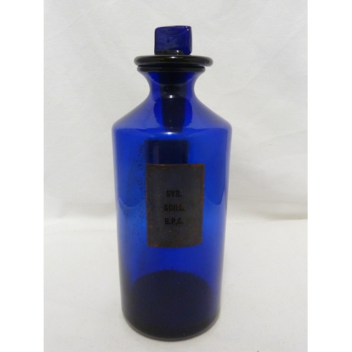 169 - A blue glass pharmacy bottle labelled SYR.SCILL. B.P.C, 25cm high