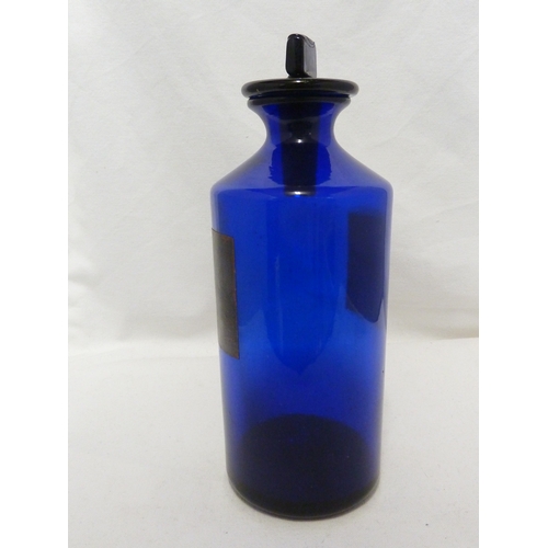 169 - A blue glass pharmacy bottle labelled SYR.SCILL. B.P.C, 25cm high