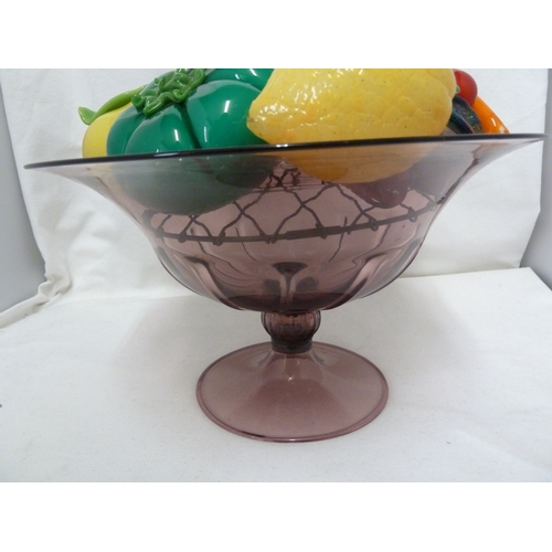 128 - An M.V.M Cappellin glass tazza of dark lilac colour filled with various coloured glass fruit, includ... 