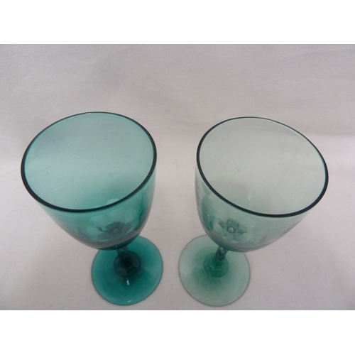 163 - A pair of uranium green wine glasses, with honeycomb cut stems, probably Richardsons (2)