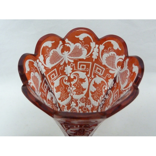 96 - A Bohemian overlay glass soli fleur, red and cut through to colourless glass with foliate 'c' scroll... 