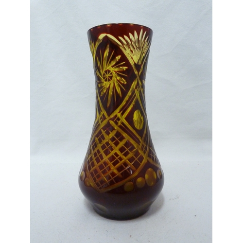 97 - A Bohemian overlay glass vase, of ruby cut through to pale green with trellis, lenses and spiral sun... 