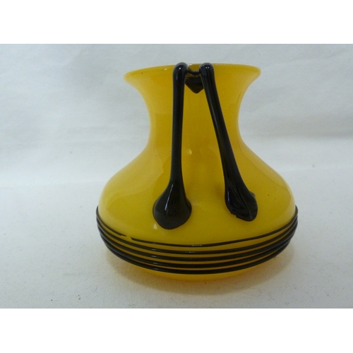 104 - Loetz - a Tango glass vase, yellow over white with black trails, 9.5cm high approx.