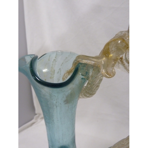 146 - A Venetian glass Dragon jug, of globe and shaft shape the coiled dragon forming the handle, the body... 