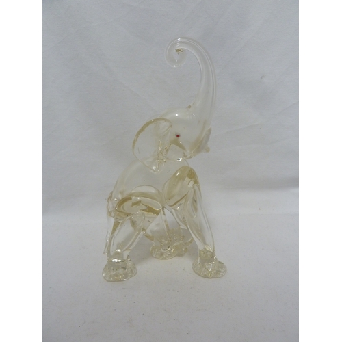 141 - Murano Glass - Two Elephant figures, of ruby and white, with opaque white glass tusks, 24cm high (2)