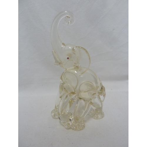 141 - Murano Glass - Two Elephant figures, of ruby and white, with opaque white glass tusks, 24cm high (2)