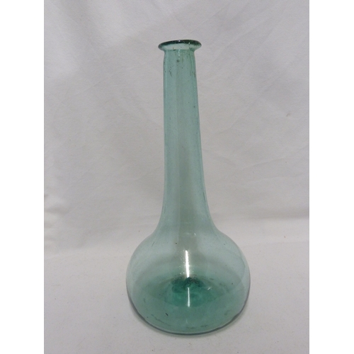 195 - A 19th Century English glass wine bottle, of pale sea green colour, 30cm high