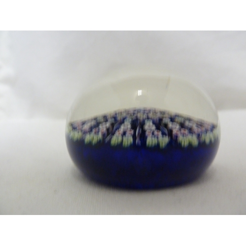 28 - Perthshire Glass - Two cartwheel millifiori glass paperweights, of dark blue ground and a mottled sk... 