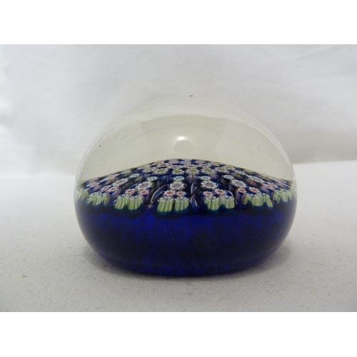 28 - Perthshire Glass - Two cartwheel millifiori glass paperweights, of dark blue ground and a mottled sk... 