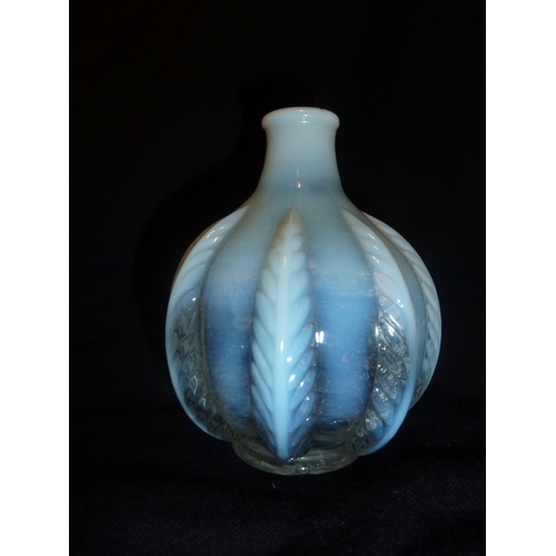 50 - French Glass - an opalescent squat bottle form vase moulded with stiff leaf design, 11cm approx