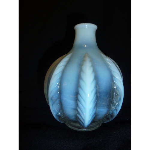 50 - French Glass - an opalescent squat bottle form vase moulded with stiff leaf design, 11cm approx