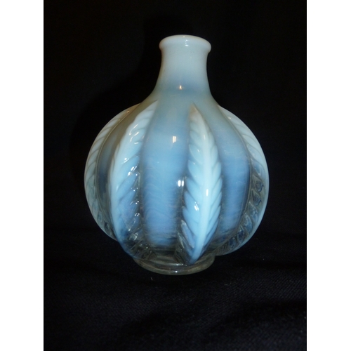 50 - French Glass - an opalescent squat bottle form vase moulded with stiff leaf design, 11cm approx