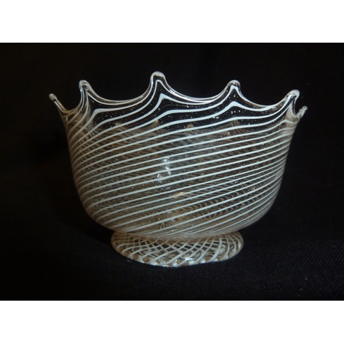 211 - A facon de venise glass bowl, the body with finely worked opaque white spiraled trail beneath a scal... 