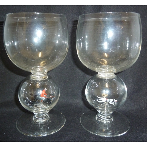 190 - William Swingewood - a pair of lampwork goblets, the colourless glass stems with enlarged hollow bal... 