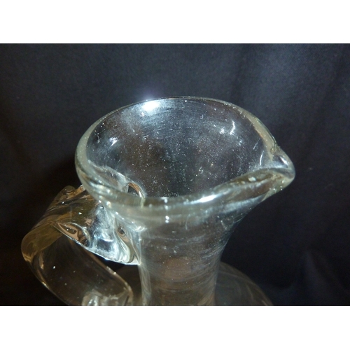 202 - A Spanish cut glass claret jug, the flattened globe and shaft body cut with a central stylised flowe... 