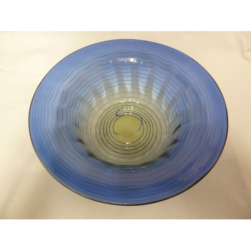 10 - James Powell and Son, Whitefriars Limited - A blue thread on sea green ground glass bowl, 26cm diam.