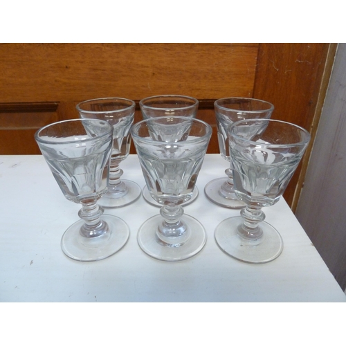 198 - A set of six Victorian toasting glasses, the panelled bowls with deceptive interior on bladed knop s... 