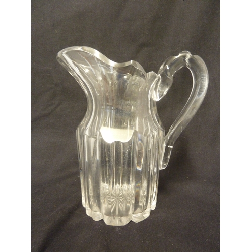 208 - English glass, probably, Apsley Pellatt - a colourless glass table water jug, with bladed body and f... 