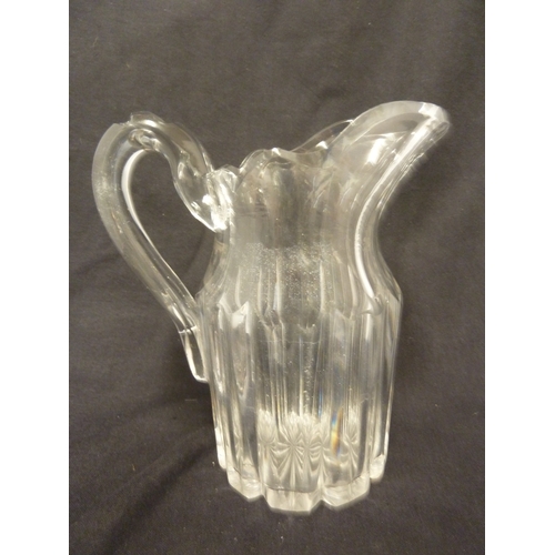 208 - English glass, probably, Apsley Pellatt - a colourless glass table water jug, with bladed body and f... 