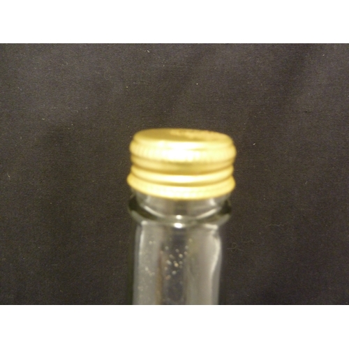 194 - A glass puzzle bottle, containing packs of cards in boxes, 20th Century, 34cm high approx.