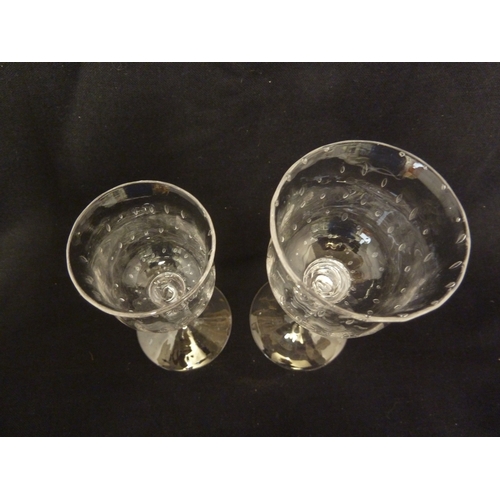 4 - Two James Powell & Sons, Whitefriars Limited spiral air trap stem glasses, each of bell form bowl wi... 