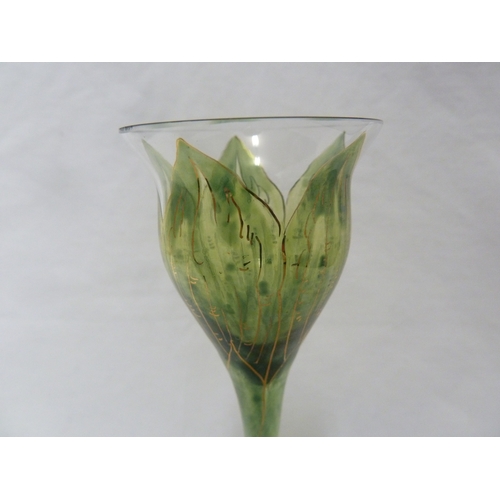 62 - A Continental Art Nouveau liqueur glass, finely enamelled in green to resemble a tulip flower, Meyr'... 