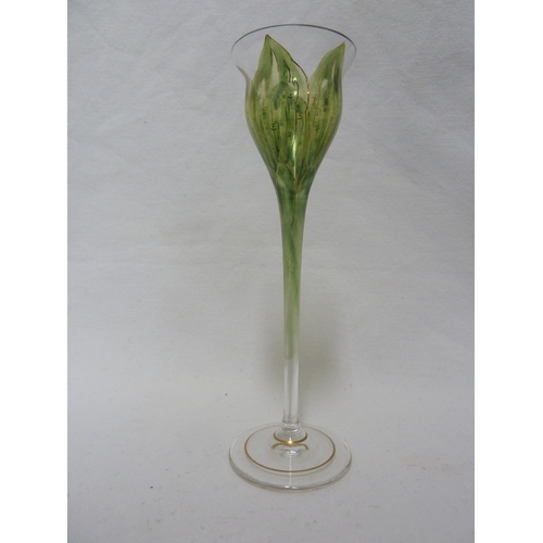 62 - A Continental Art Nouveau liqueur glass, finely enamelled in green to resemble a tulip flower, Meyr'... 