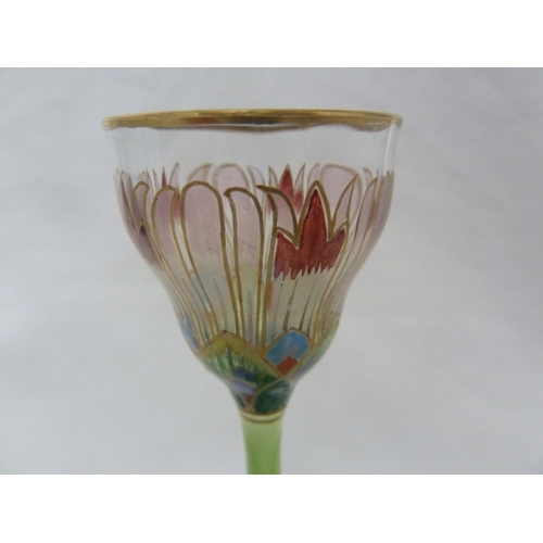 67 - A Continental Art Nouveau liqueur glass, finely enamelled in polychrome colours in the form of an Eg... 