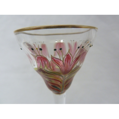 70 - A Continental Art Nouveau liqueur glass, finely enamelled in polychrome colours to resemble a group ... 