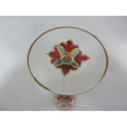 70 - A Continental Art Nouveau liqueur glass, finely enamelled in polychrome colours to resemble a group ... 