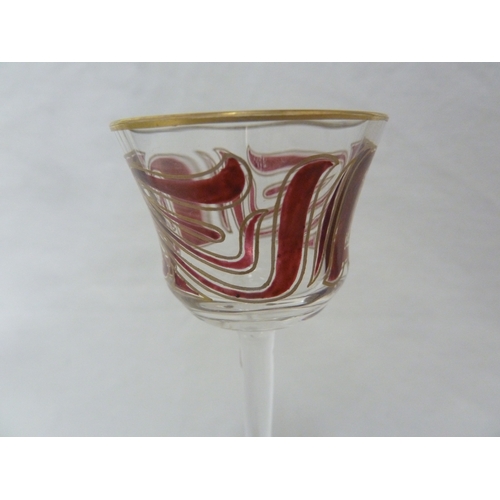 71 - A Continental Art Nouveau liqueur glass, finely enamelled in purple/pink in the style of Islamic cal... 