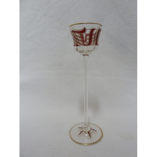 71 - A Continental Art Nouveau liqueur glass, finely enamelled in purple/pink in the style of Islamic cal... 