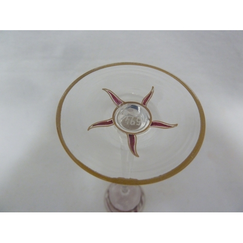 71 - A Continental Art Nouveau liqueur glass, finely enamelled in purple/pink in the style of Islamic cal... 