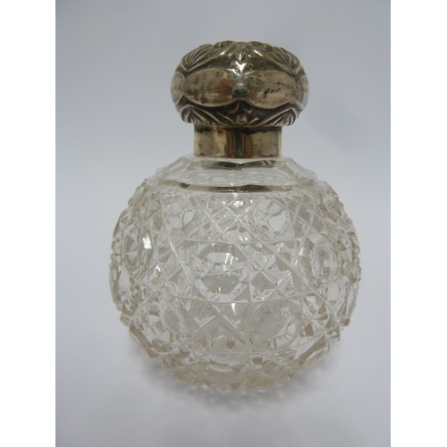 197 - A silver mounted cut glass perfume bottle, screw top, globular and cut with a hobnail pattern, Birmi... 