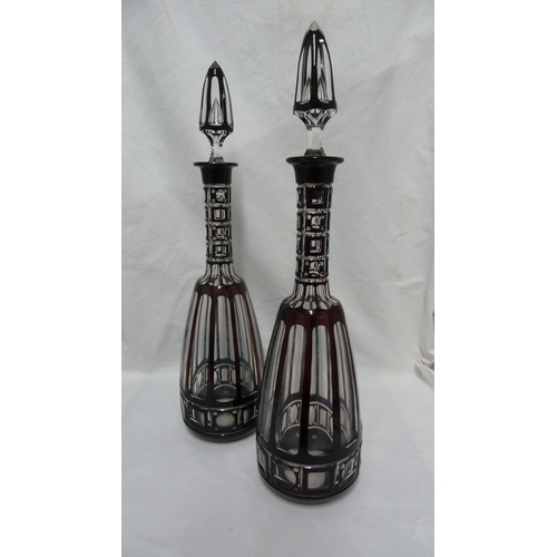 98 - Bohemian glass, a large pair of mallet form decanters of deep ruby overlay cut through to colourless... 