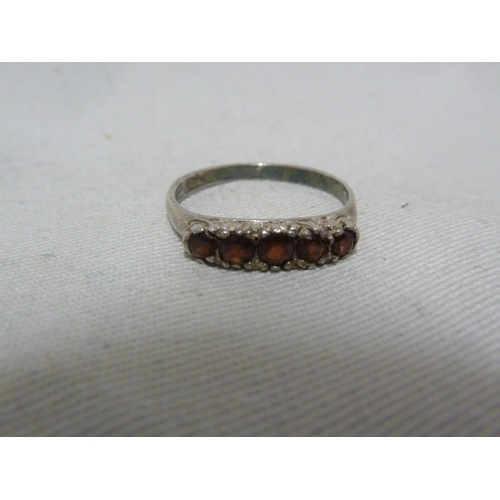 16 - A marcasite set dress ring, the shank stamped 9ct and SIL, ring size M, 5.4 grms; a Silver ring set ... 