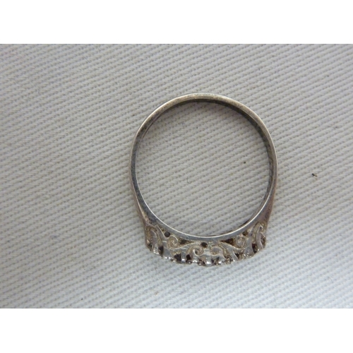 16 - A marcasite set dress ring, the shank stamped 9ct and SIL, ring size M, 5.4 grms; a Silver ring set ... 