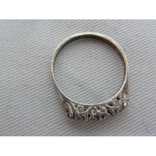 16 - A marcasite set dress ring, the shank stamped 9ct and SIL, ring size M, 5.4 grms; a Silver ring set ... 