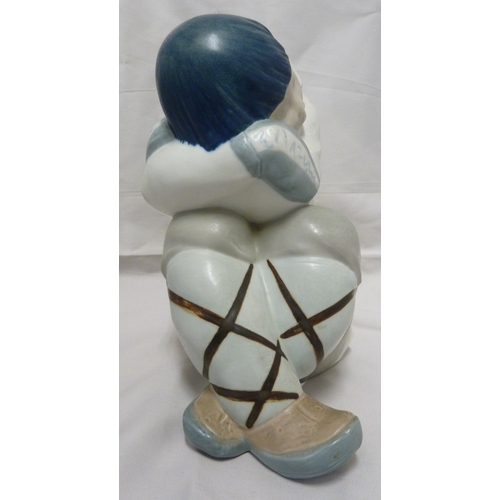 58 - A large size Lladro porcelain figure of a seated Inuit boy, polychrome colouring, impressed 2007, pr... 